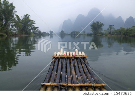 China Guilin Yangshuo bamboo rafting in the beautiful "Yulong River" China Guilin Yangshuo bamboo rafting in the beautiful "Yulong River" 15473655