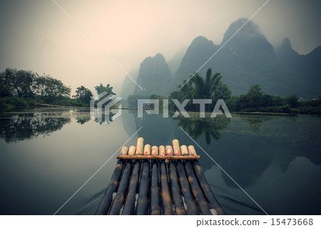 China Guilin Yangshuo bamboo rafting in the beautiful "Yulong River" China Guilin Yangshuo bamboo rafting in the beautiful "Yulong River" 15473668