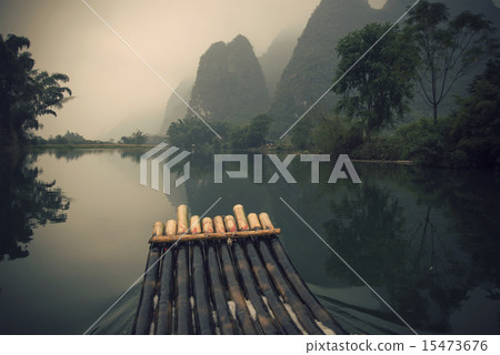 China Guilin Yangshuo bamboo rafting in the beautiful "Yulong River" China Guilin Yangshuo bamboo rafting in the beautiful "Yulong River" 15473676