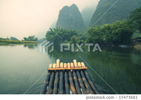 China Guilin Yangshuo bamboo rafting in the beautiful "Yulong River" China Guilin Yangshuo bamboo rafting in the beautiful "Yulong River" 15473681