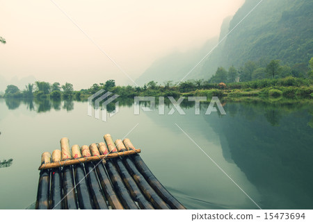 China Guilin Yangshuo bamboo rafting in the beautiful "Yulong River". China Guilin Yangshuo bamboo rafting in the beautiful "Yulong River". 15473694