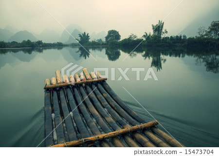 China Guilin Yangshuo bamboo rafting in the beautiful "Yulong River" China Guilin Yangshuo bamboo rafting in the beautiful "Yulong River" 15473704