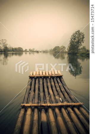 China Guilin Yangshuo bamboo rafting in the beautiful "Yulong River" 15473714