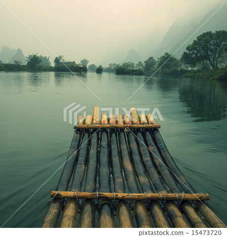 China Guilin Yangshuo bamboo rafting in the beautiful "Yulong River" China Guilin Yangshuo bamboo rafting in the beautiful "Yulong River" 15473720
