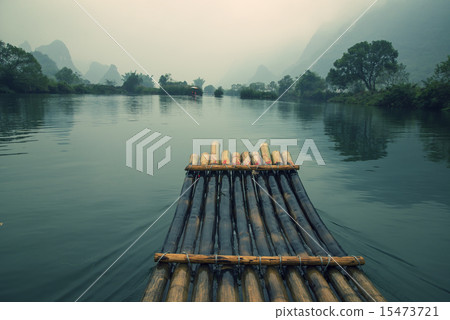 China Guilin Yangshuo bamboo rafting in the beautiful "Yulong River" China Guilin Yangshuo bamboo rafting in the beautiful "Yulong River" 15473721