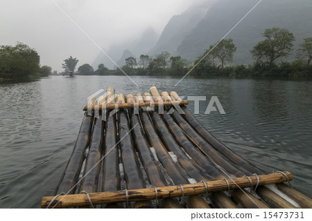 China Guilin Yangshuo bamboo rafting in the beautiful "Yulong River" China Guilin Yangshuo bamboo rafting in the beautiful "Yulong River" 15473731