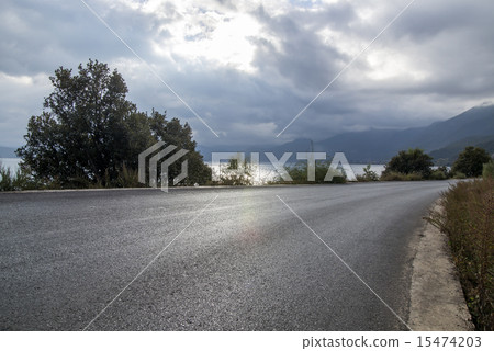 Quiet lakeside road Quiet lakeside road 15474203