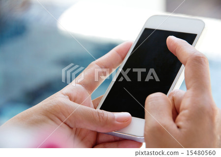 Woman Using a Smart Phone 15480560