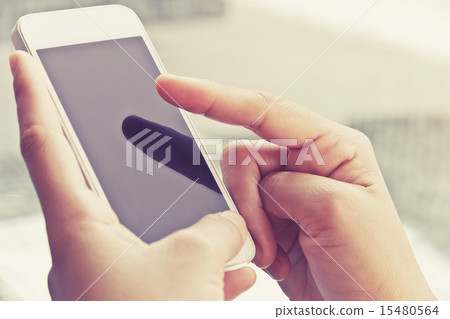 Woman Using a Smart Phone 15480564