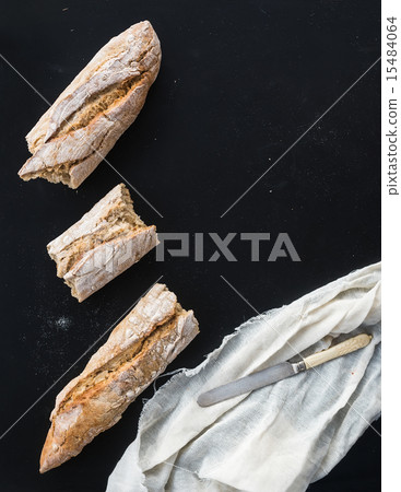 French baguette broken into pieces French baguette broken into pieces 15484064