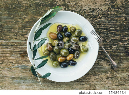 A plate of Mediterranean olives in olive oil A plate of Mediterranean olives in olive oil 15484384
