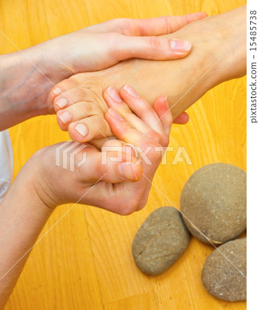 female foot on massage spa treatment female foot on massage spa treatment 15485738