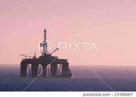 Oil Drill Rig with Supply vessel by her side Oil Drill Rig with Supply vessel by her side 15486667