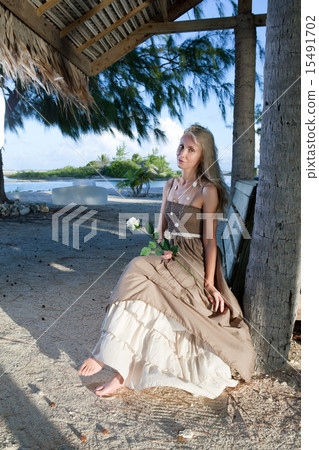 young woman in a long sundress on a tropical beach 15491702