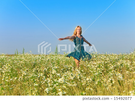 happy young woman  in the field  of camomiles 15492077