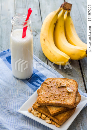banana smoothie, toast with peanut butter, peanuts 15497003