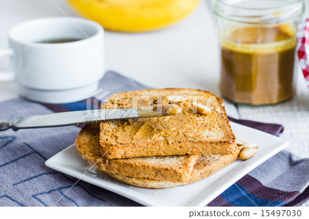 crispy toast with peanut butter, bananas, coffee 15497030
