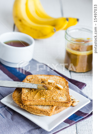 crispy toast with peanut butter, bananas, coffee crispy toast with peanut butter, bananas, coffee 15497033