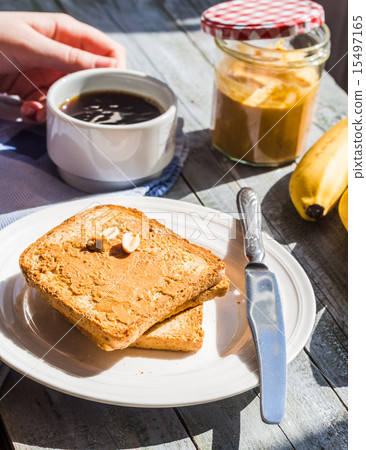 ruddy toast with peanut butter, fresh bananas ruddy toast with peanut butter, fresh bananas 15497165