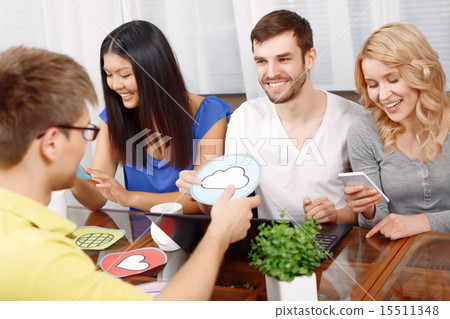 Smart handsome app developer with his team Smart handsome app developer with his team 15511348