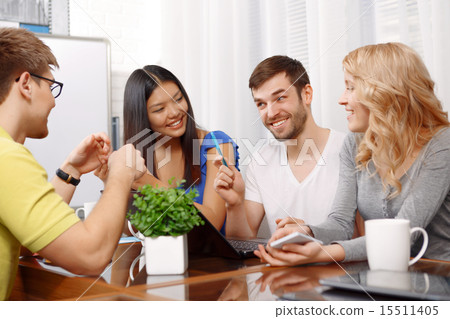 Smart handsome app developer with his team Smart handsome app developer with his team 15511405