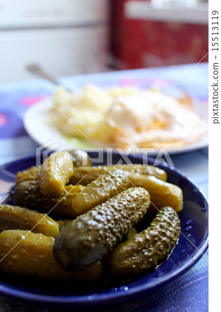 Cucumbers marinaded and mashed potatoes 15513119