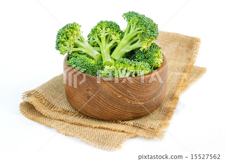Broccoli head in wooden bowl on sackcloth. 15527562