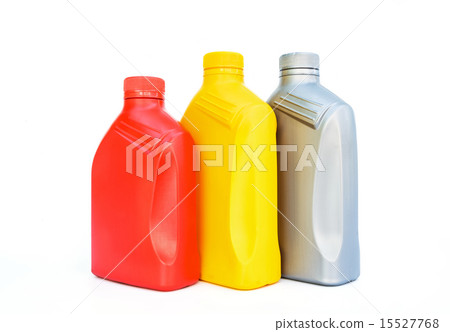 Plastic canisters with machine oil on white. Plastic canisters with machine oil on white. 15527768