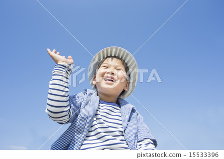 A child with a blue sky and hands A child with a blue sky and hands 15533396