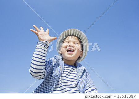 A child with a blue sky and hands 15533397
