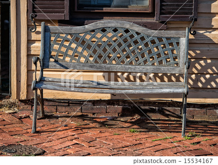 isolated bench on wood old house background 15534167