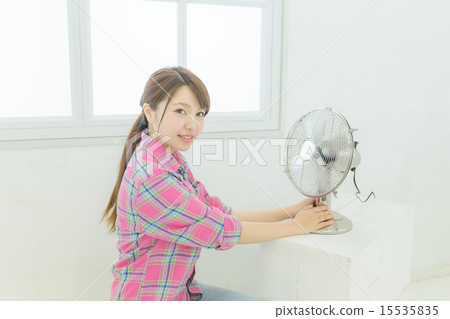 A female image using a fan 15535835