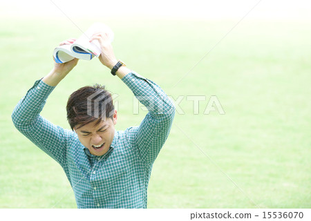 Chinese student throwing his textbook 15536070