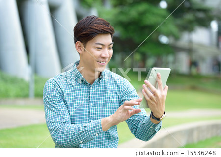 Chinese student using ebook Chinese student using ebook 15536248