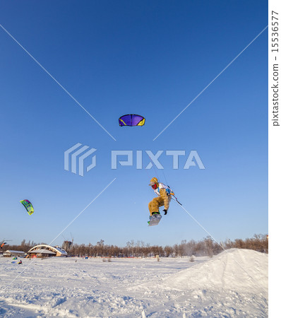 Kiteboarder with kite on the snow Kiteboarder with kite on the snow 15536577