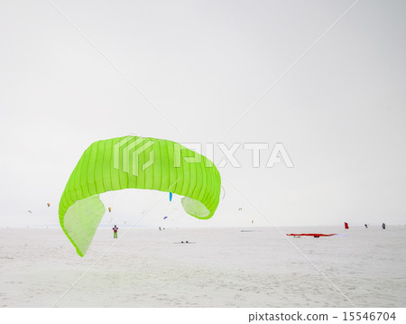Kiteboarder with kite on the snow Kiteboarder with kite on the snow 15546704