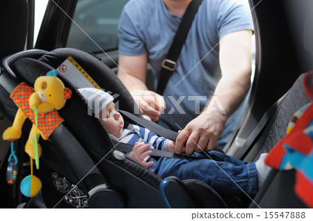 Little boy in car seat 15547888