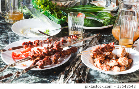 table with shish kebabs and vegetables table with shish kebabs and vegetables 15548548