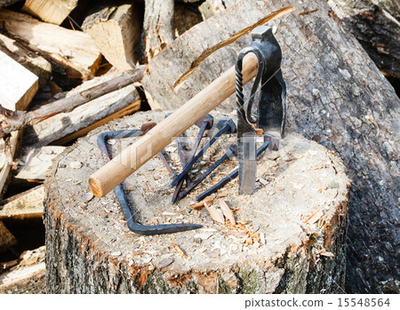 hew axe and forged hardware on wooden block hew axe and forged hardware on wooden block 15548564