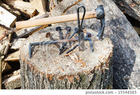 hew ax and forged hardware on wooden deck 15548565