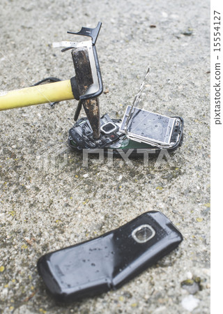 Old broken mobile phone 15554127