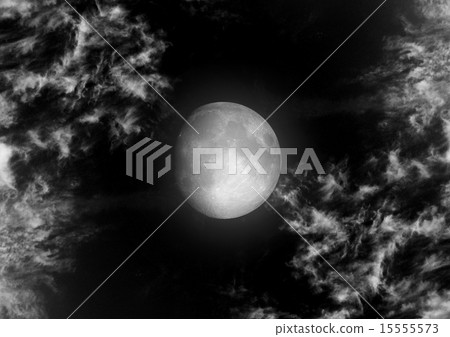 The moon in the night sky in clouds 15555573