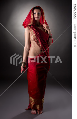 Mehndi. Charming model posing semi-nude in sari 15557893