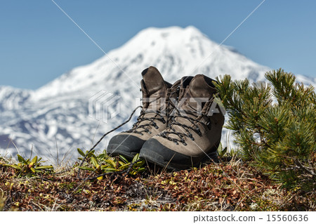 Trekking boots on background volcano Trekking boots on background volcano 15560636