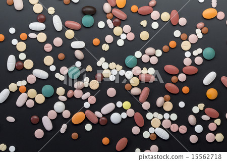 Different colorfull pills on black Different colorfull pills on black 15562718