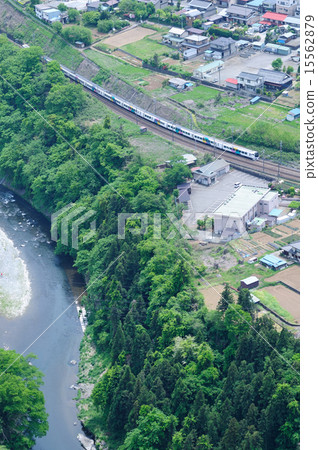 Limited express train on the central line running along the mountain stream of Katsuragawa 15562879