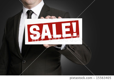 Sale sign held by businessman 15563405