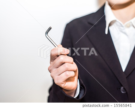 Business woman with hex wrench 15565841