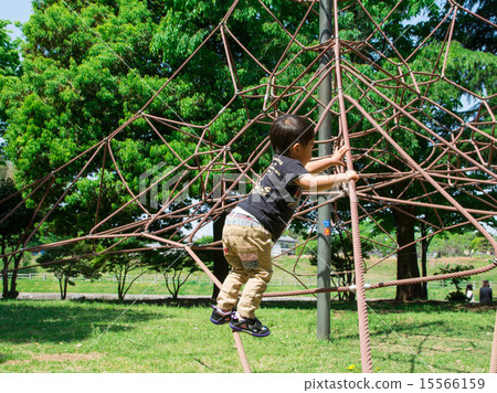 A boy playing in a fresh green park 15566159