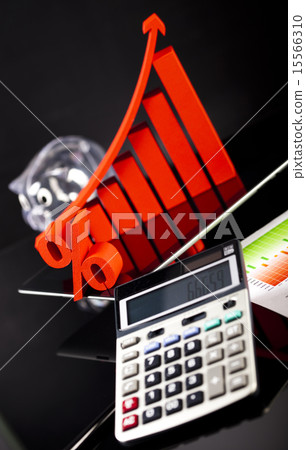 Financial graph on tablet with calculator Financial graph on tablet with calculator 15566310